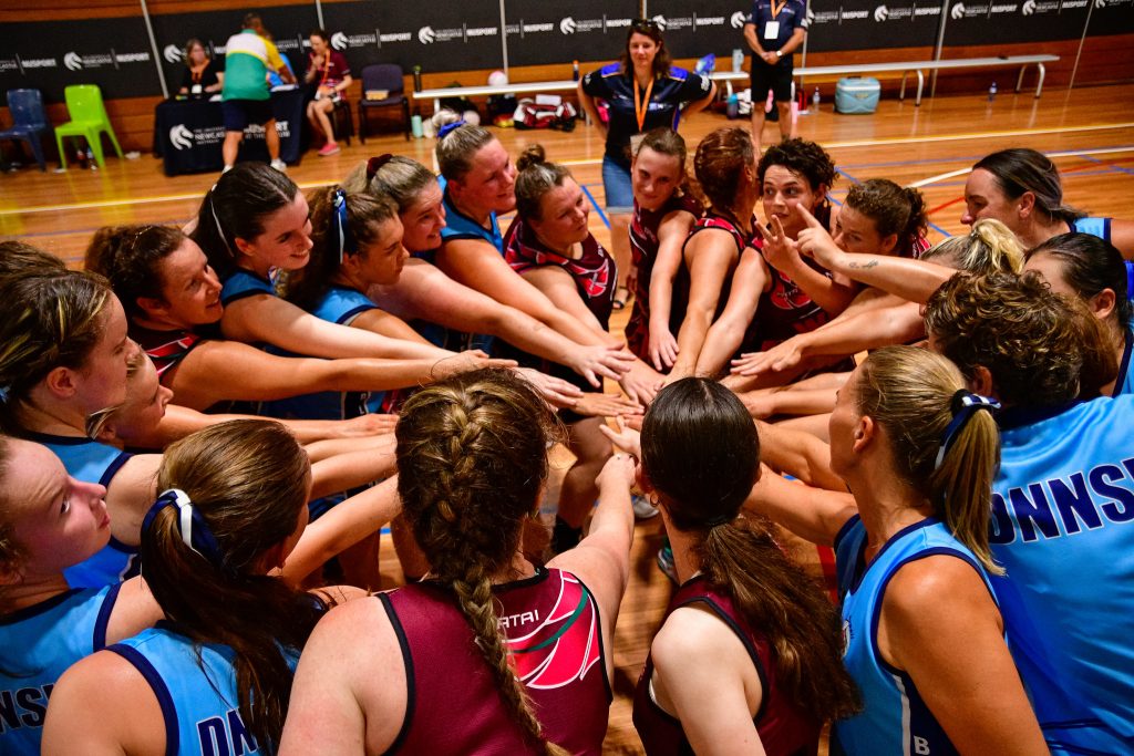 'Hands In', to celebrate the end of the preliminary stages of the netball competition at the Australian Deaf Games (January 2024). Image: Simon Leonard