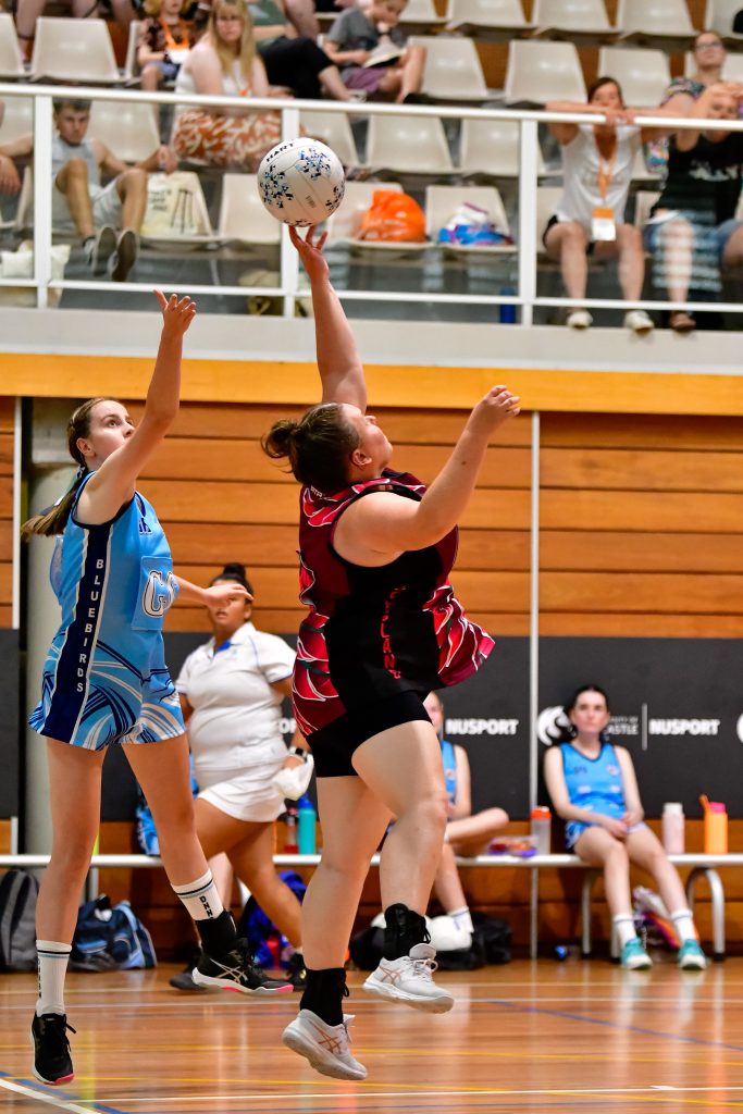 Qld defender Chloe Haywood snaffles a high pass from NSW. Image: Simon Leonard