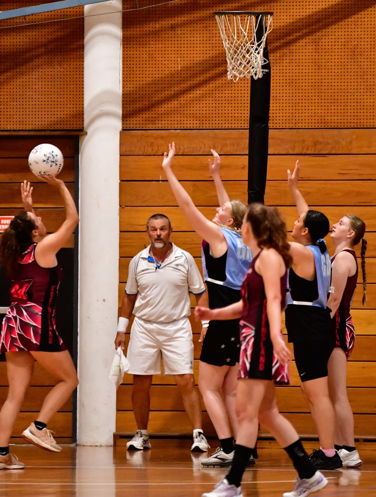 Umpire and Netball convenor, Larry Brown with flag at the ready. Image: Simon Leonard