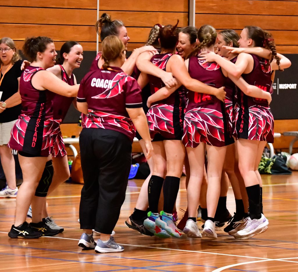 Queensland celebrate winning a bronze medal (in netball) at the Australian Deaf Games. Image: Simon Leonard