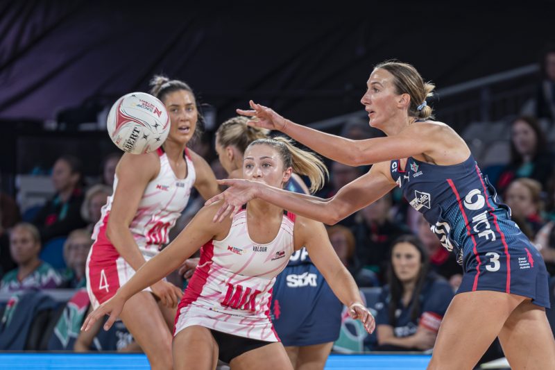 Em Mannix passes off against Thunderbirds pressure. Image Shaun Sharp/Moments By Shaun