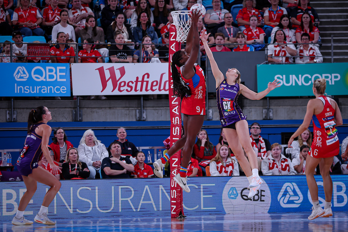 Ash Barnett struggles to match the impressive elevation of Grace Nweke. Image: May Bailey